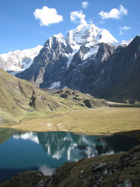 Reflections on a glacier lake in Huayhuash Range, Peru