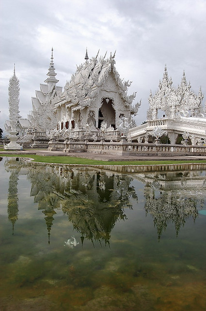 Reflections of Wat Rong Khun in Chiang Rai, Thailand