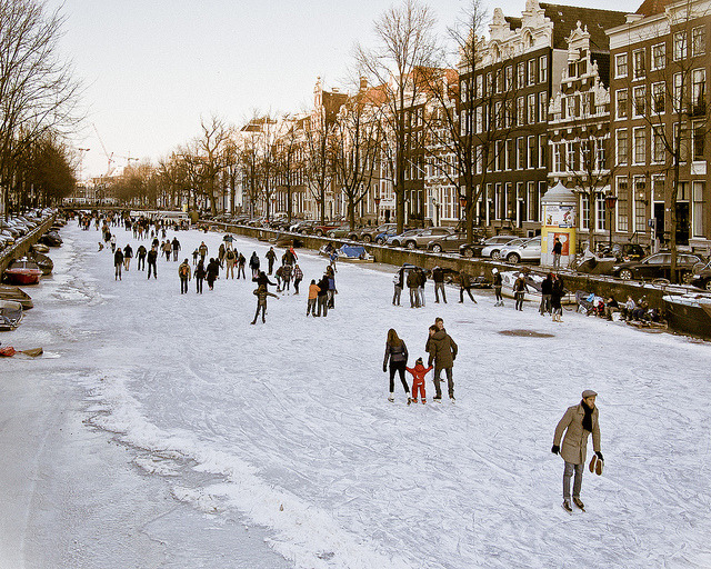 Ice skaters on the canals of Amsterdam, Netherlands