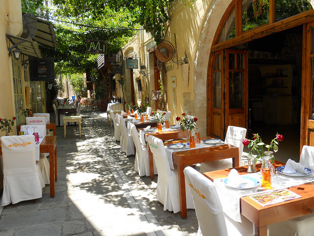 Outdoor seating in the narrow streets of Rethymno, Greece