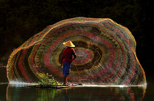 Fisherman at work, Depok Lake, Indonesia